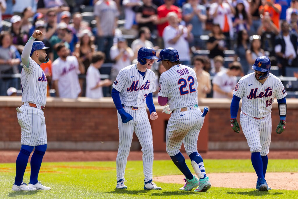 New York Mets left fielder Juan Soto (22) celebrates with right fielder Carson Benge (3) after Soto scores on his grand slam.