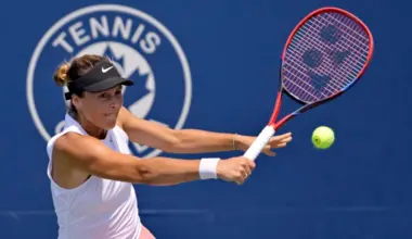 Jul 28, 2025; Montreal, QC, Canada; Tatjana Maria (GER) reacts returns the ball against Laura Siegemund (GER) in first round play at IGA Stadium. Mandatory Credit: Eric Bolte-Imagn Images