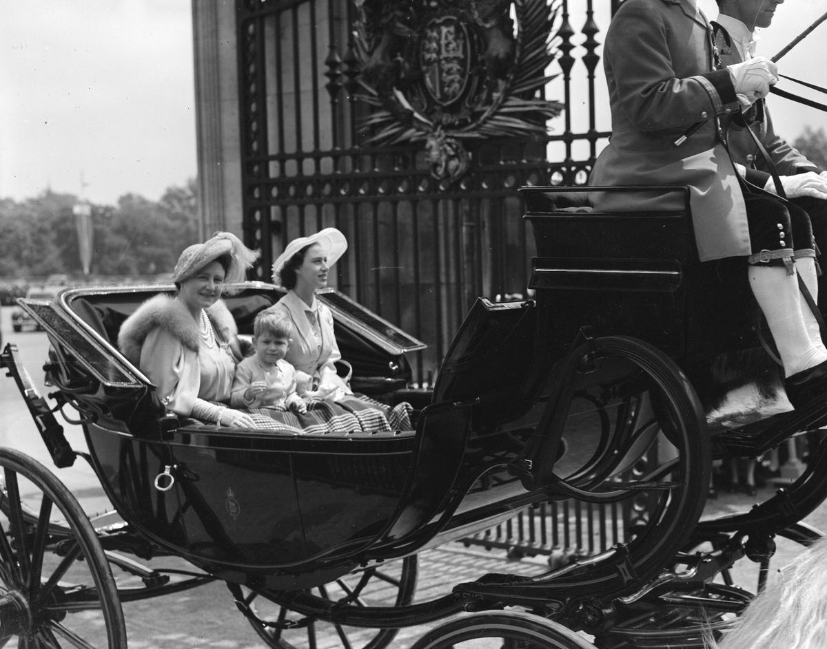 7th June 1951:  Queen Elizabeth, Queen Consort to King George VI with Princess Margaret Rose (1930 - 2002) and Prince Charles returning to Buckingham Palace after the Trooping The Colour ceremony