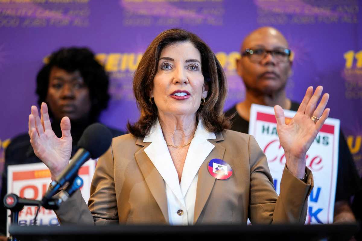 Gov. Kathy Hochul speaks to the media during a rally with immigration advocates, on the day of the U.S. Supreme Court ruling allowing the Trump administration to strip Temporary Protected Status (TPS) protections from hundreds of thousands of Haitian and Syrian migrants, in New York City, U.S., June 25, 2026. REUTERS/Eduardo Munoz