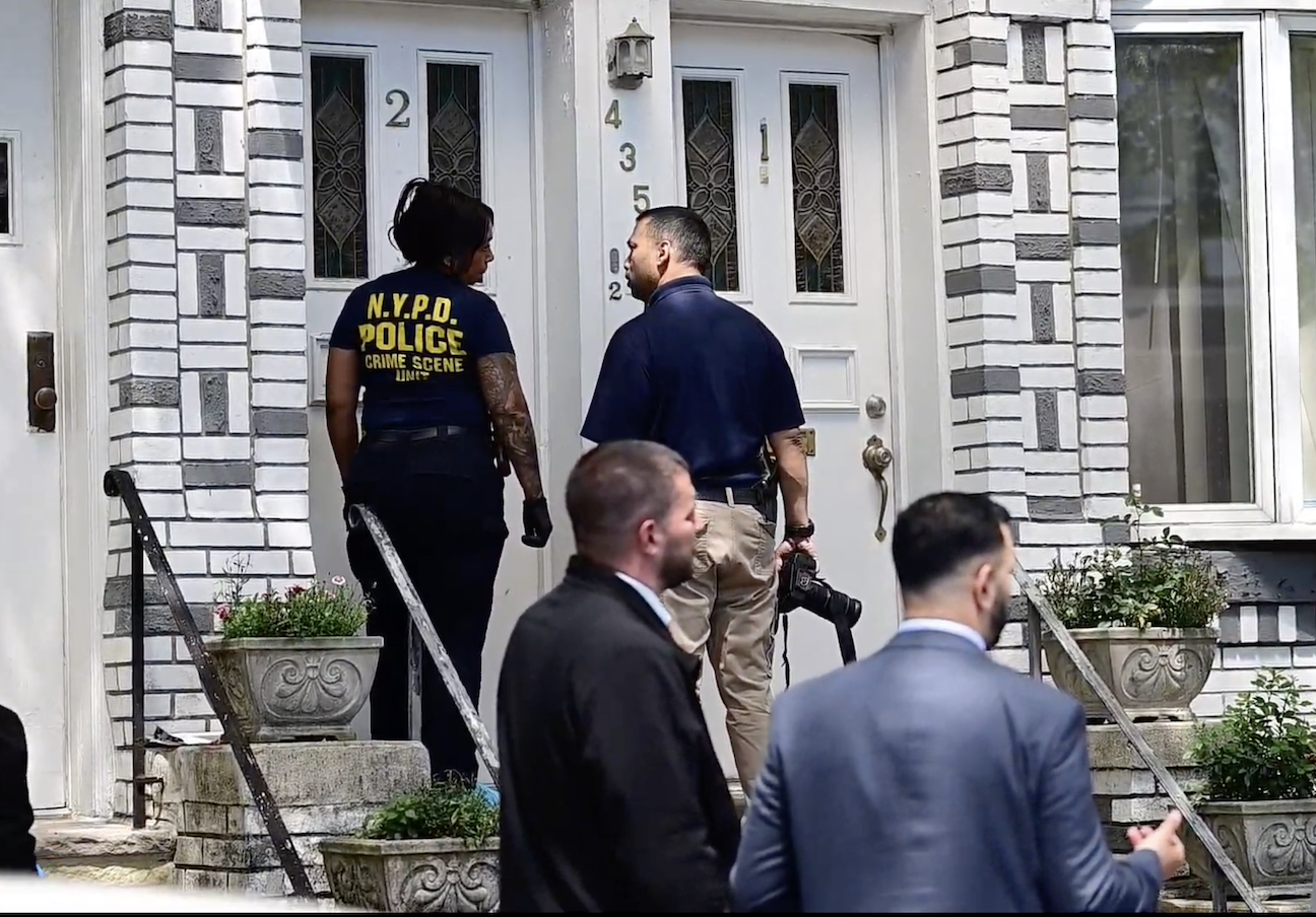 Police investigate outside the Bay Ridge home where Maria Santos Flores was found dead. Photo: Loudlabs News NYC