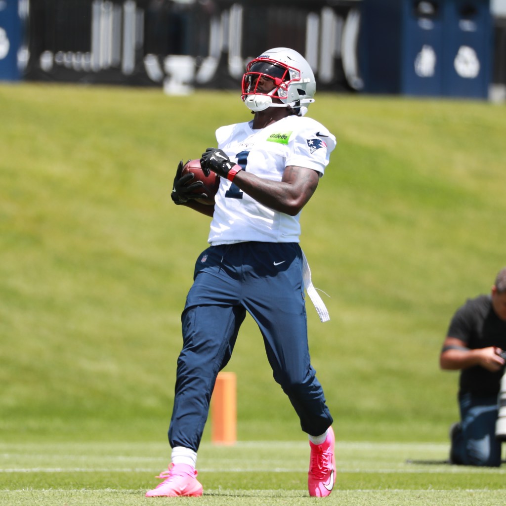 A.J. Brown #1 of the New England Patriots holds the ball during New England Patriots OTA on June 2, 2026, at Gillette Stadium in Foxborough, Massachusetts.