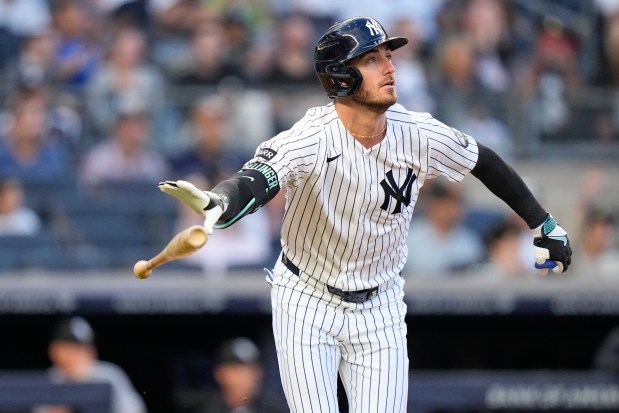 New York Yankees' Cody Bellinger tosses his bat as he watches the ball he hit for a two-run home run during the first inning of a baseball game against the Chicago White Sox on Wednesday, June 17, 2026, in New York. (AP Photo/Frank Franklin II)