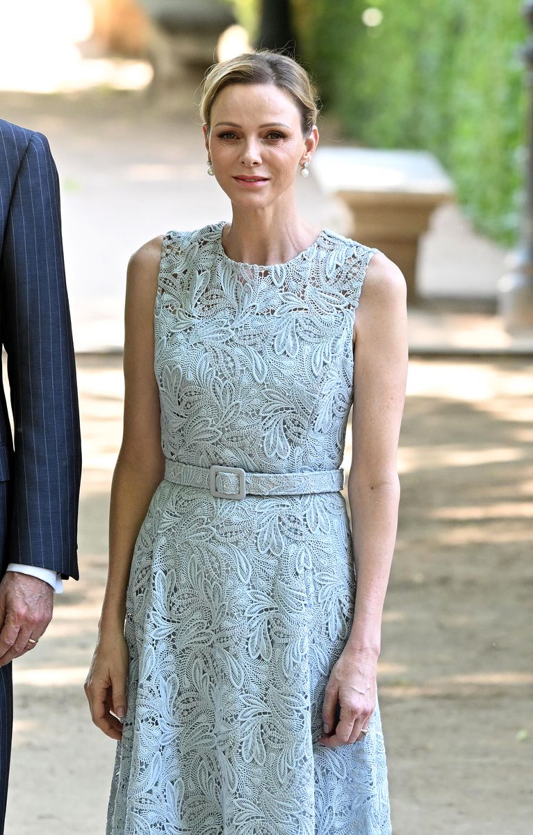 Princess Charlene embraced timeless elegance in a sky-blue Oscar de la Renta lace dress.