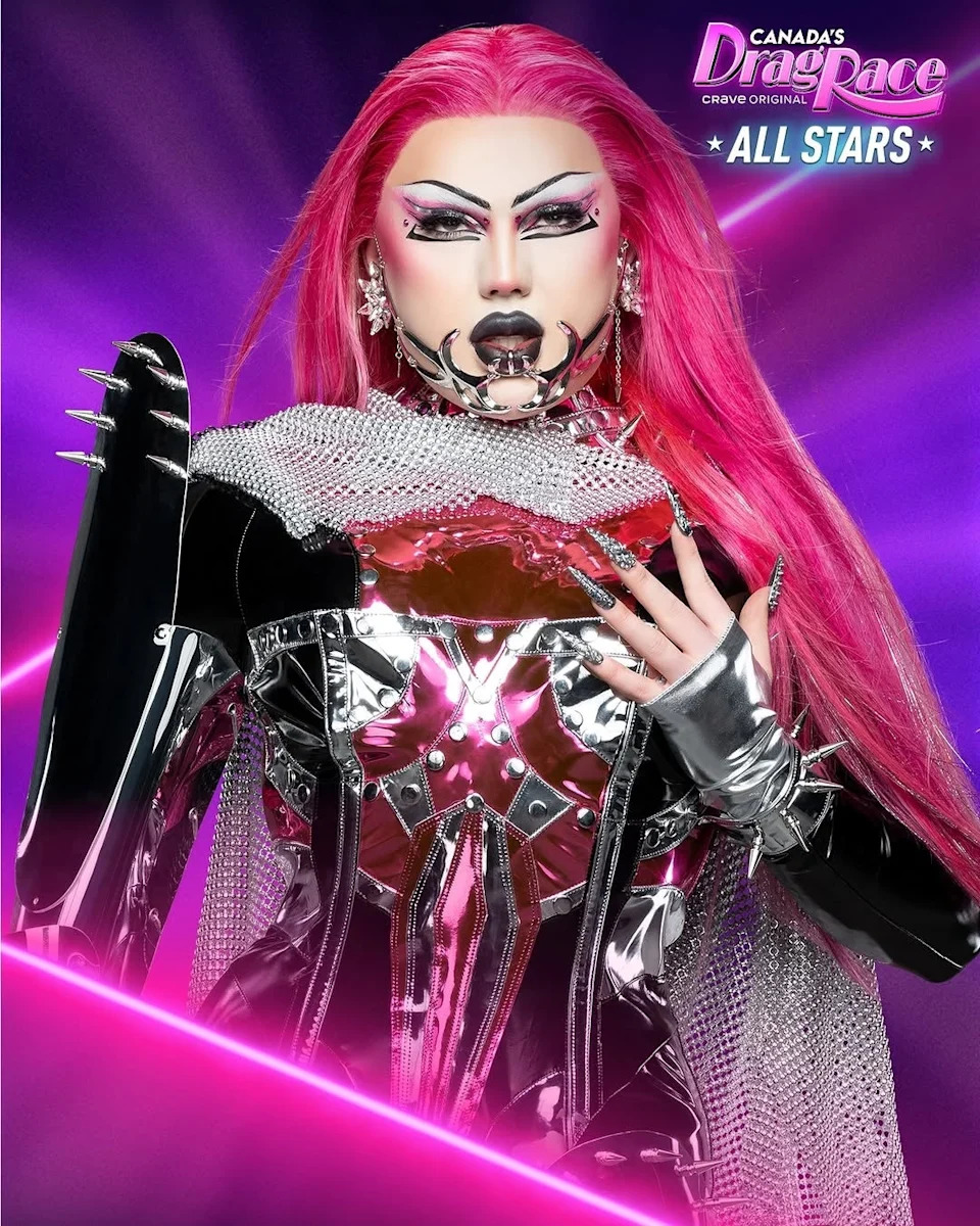 Performer in futuristic metallic outfit with striking makeup and long pink hair, promoting "Canada's Drag Race: All Stars."