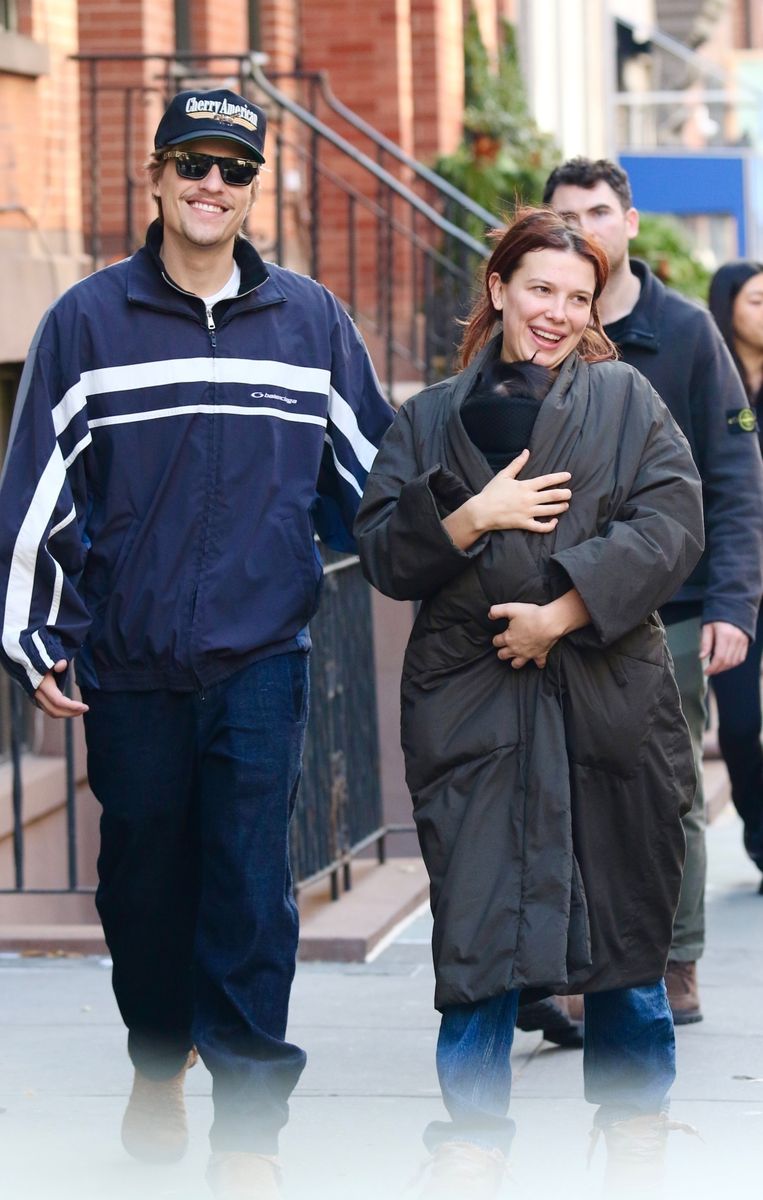 'Stranger Things' star Millie Bobby Brown, now known as Millie Bonnie Bongiovi, and husband Jake Bongiovi are all smiles as they share a tender moment with their baby daughter in Manhattan's Downtown area. 