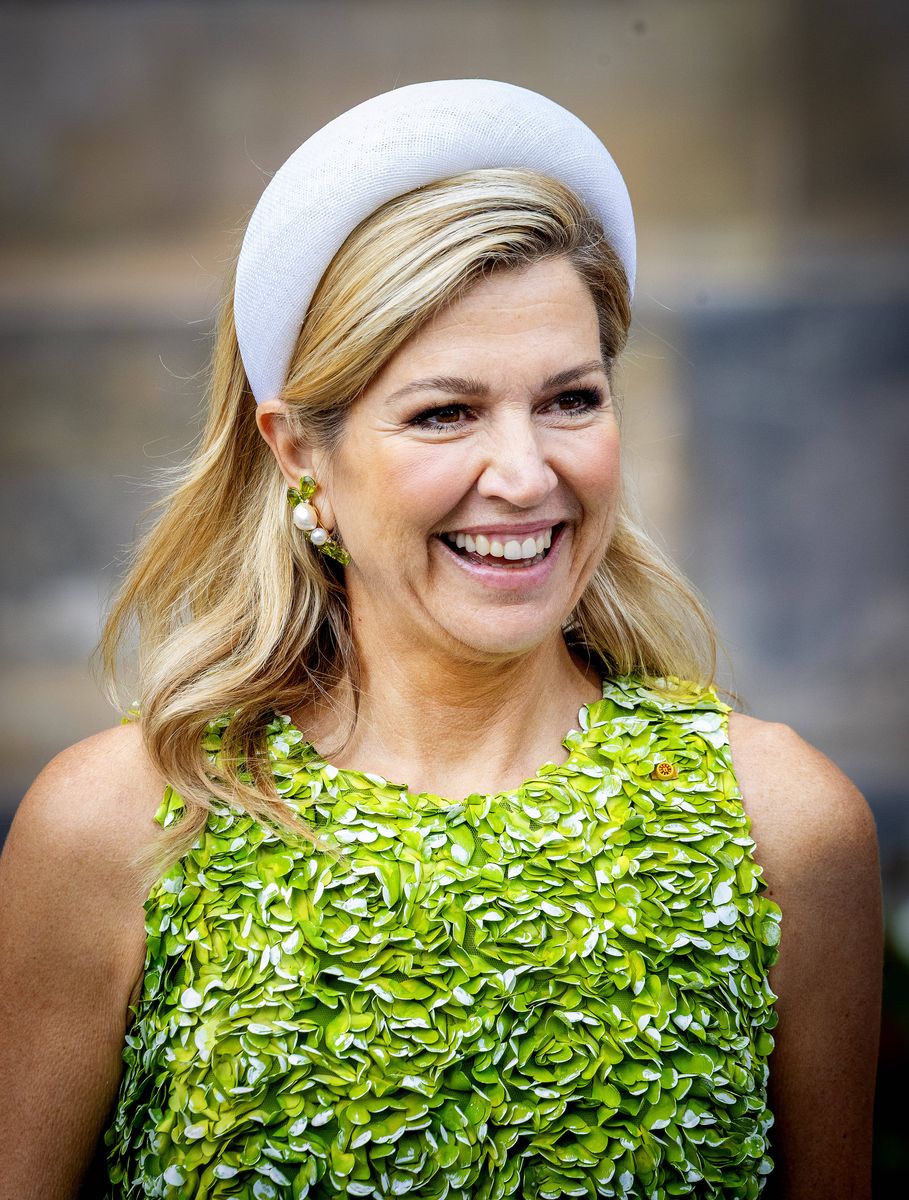 Queen Máxima made a bold fashion statement in a vibrant green floral-appliqué dress as she welcomed Emperor Naruhito and Empress Masako of Japan to Amsterdam.