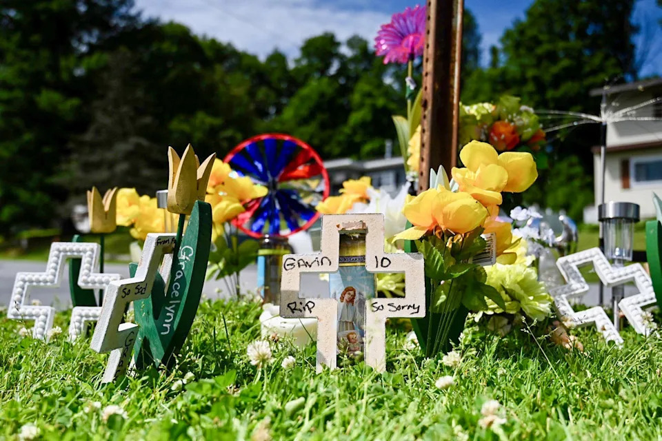 Memorial outside of the residence. (Will Waldron / Albany Times Union via Getty Images)