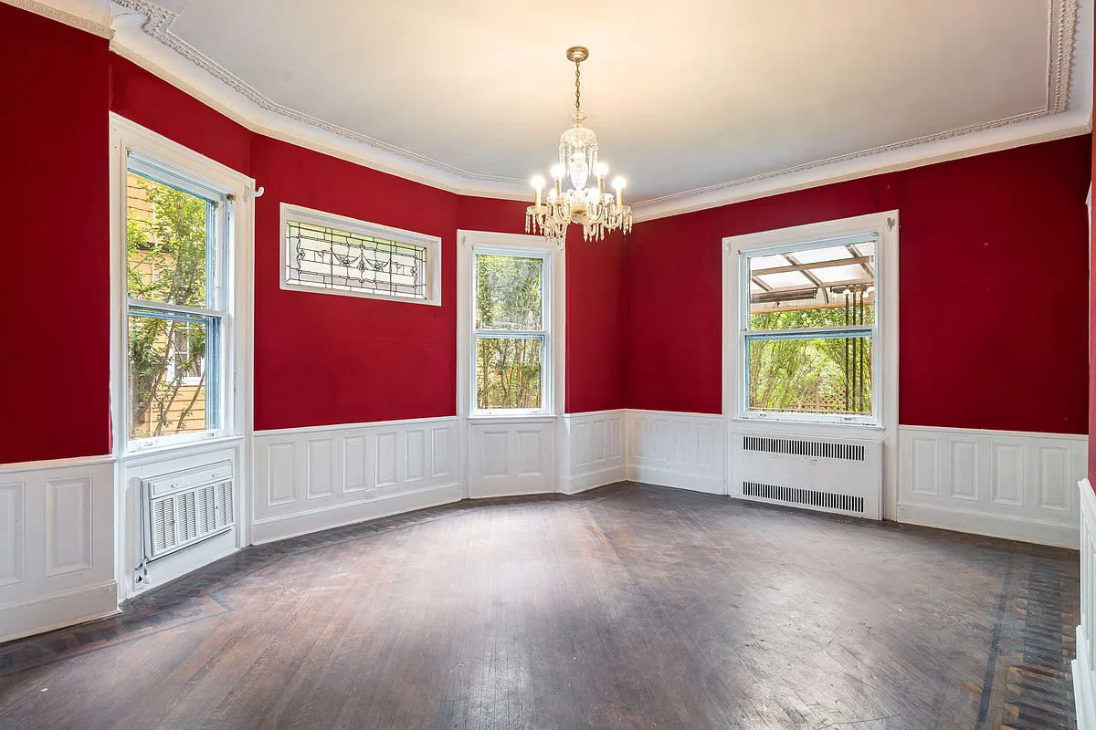 dining room with red painted walls, stained glass
