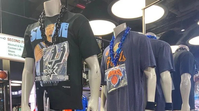 Mannequins in a store display wear Spurs and Knicks garb