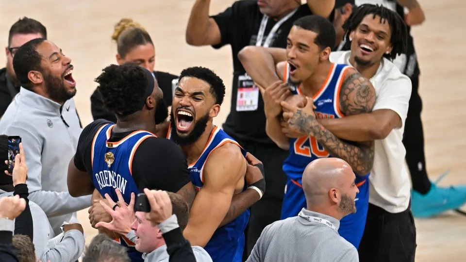 New York Knicks center Karl-Anthony Towns, right, hugs forward Og Anunoby after defeating the San Antonio Spurs in Game 5 of the NBA Finals basketball series, Saturday in San Antonio. - Darren Abate/AP
