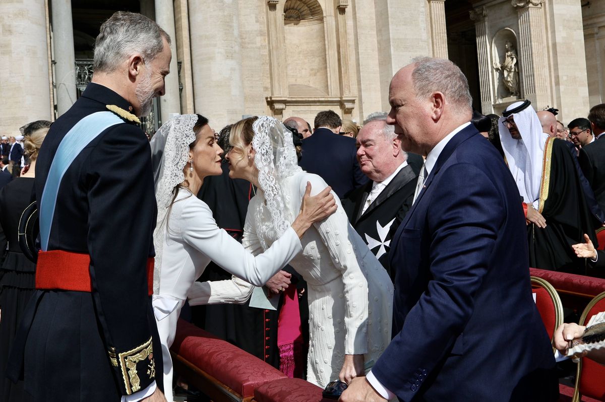 Queen Letizia and Princess Charlene greet each other during the Mass marking the beginning of the Pontificate of Pope Leo XIV.