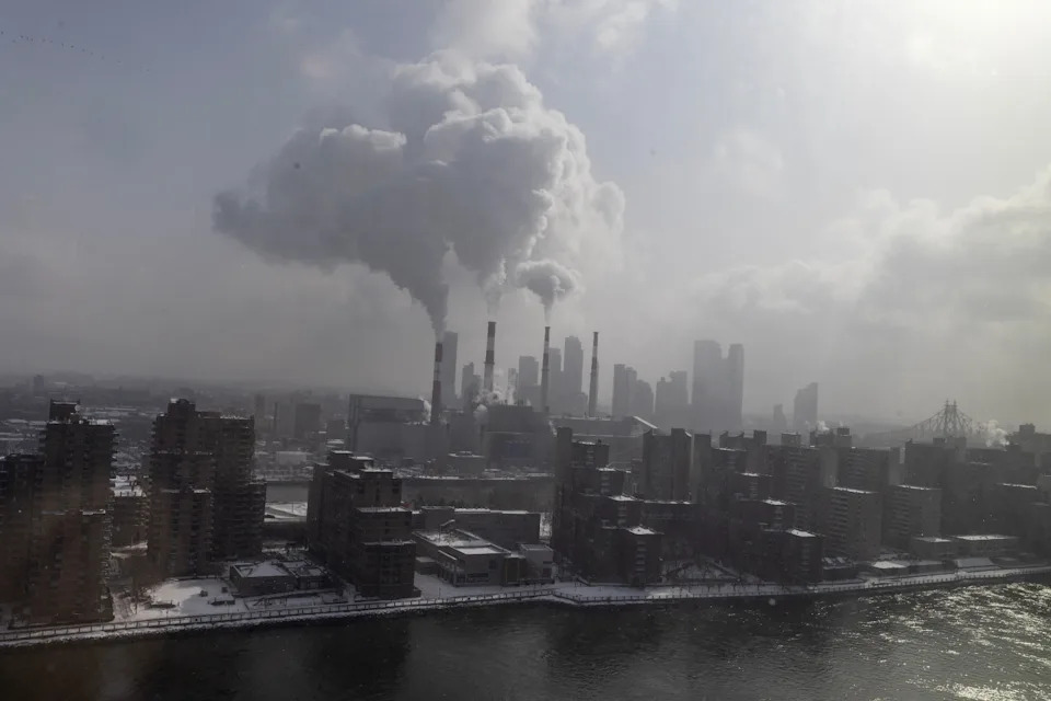 Steam rises from the smokestacks of the Ravenswood Generating Station, the largest power plant in New York City. The state has struggled to build out enough clean power to replace its natural gas power plants.