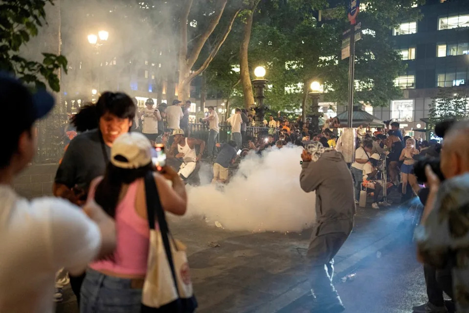 Smoke erupts on the streets of New York as Knicks fans celebrate the championship at Bryant Park on June 13, 2026. REUTERS