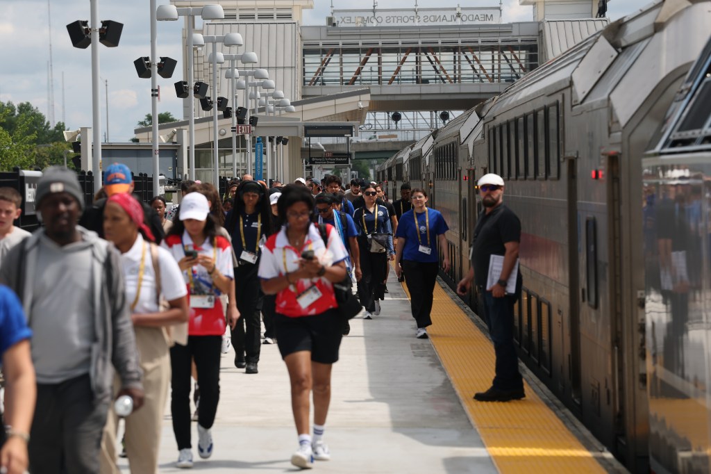 Fans and stadium workers arriving at MetLife Stadium via the Meadowlands Train Platform.
