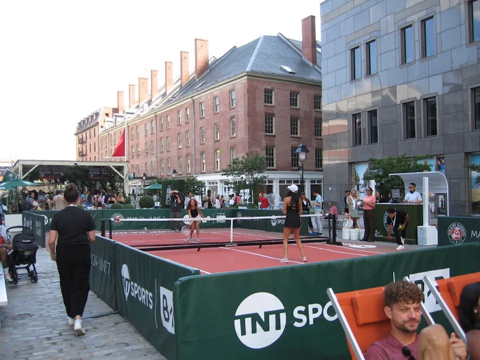 A mini tennis court and DJ booth