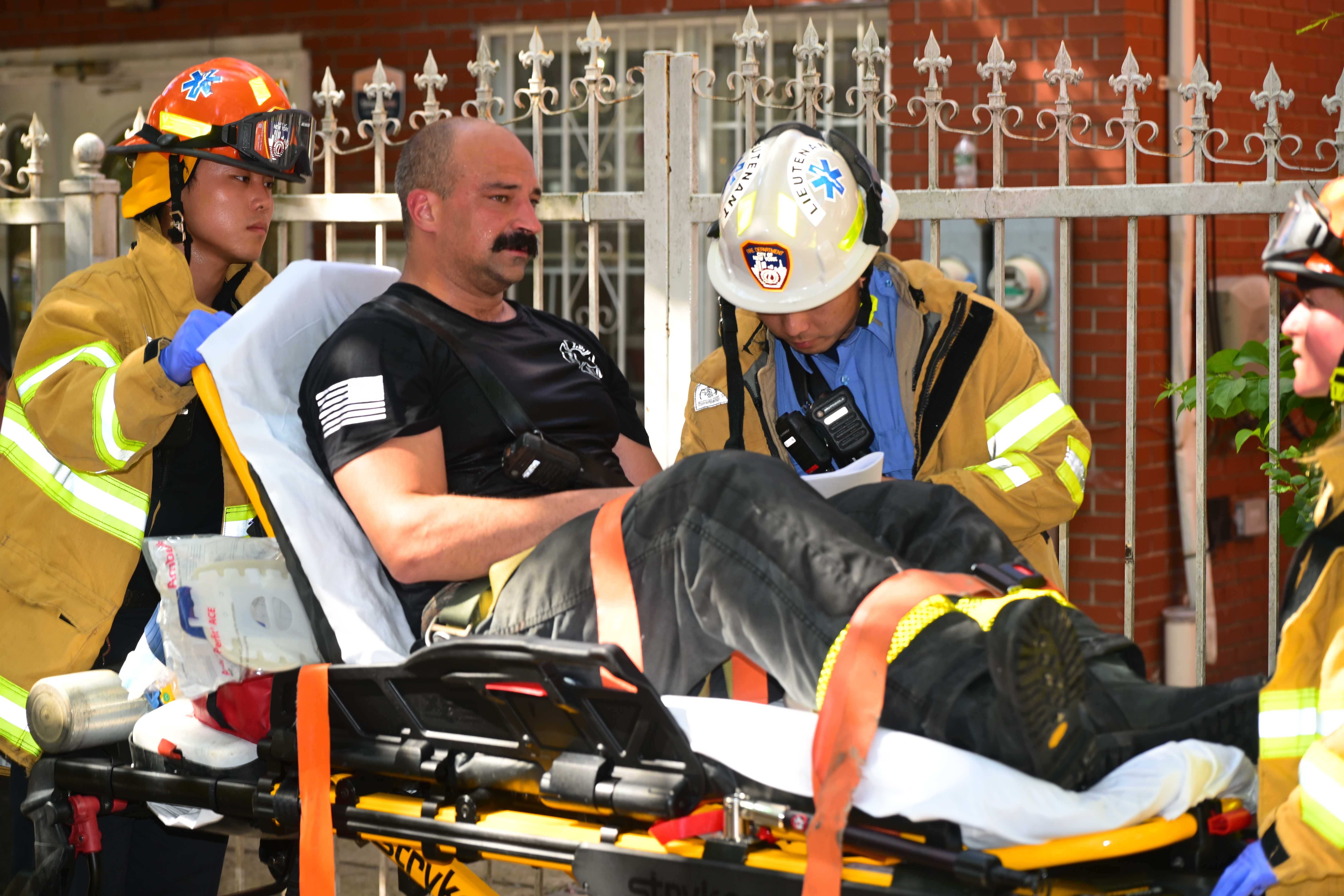 Nine firefighters were injured battling the blaze as temperatures climbed into the 90s. 