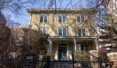 yellow wood frame house