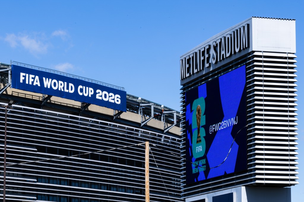 A large banner for the FIFA World Cup 2026 hangs on the side of MetLife Stadium.