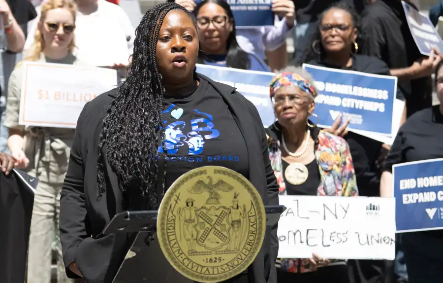 housing rally - person at a podium