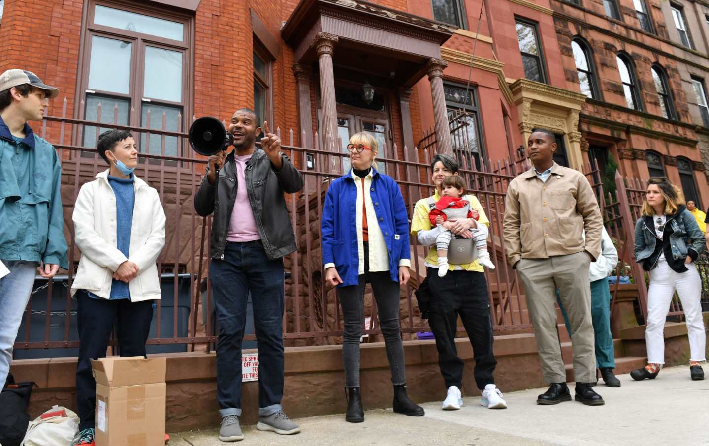 New York State Senator Jabari Brisport (third from left), with New York City Council member Chi Osse (second from right), speaks at a protest against rent increases and aggressive evictions in Brooklyn in 2022.