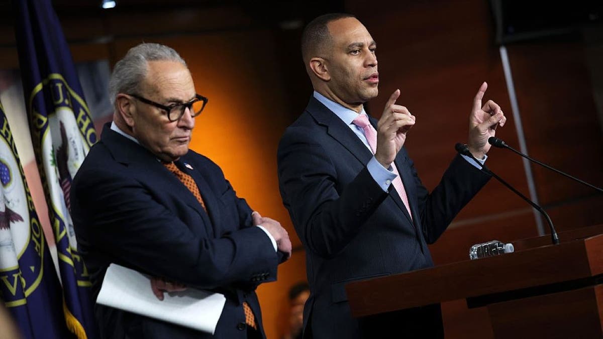 Senate Majority Leader John Thune speaking at a press conference with Hakeem Jeffries and Chuck Schumer