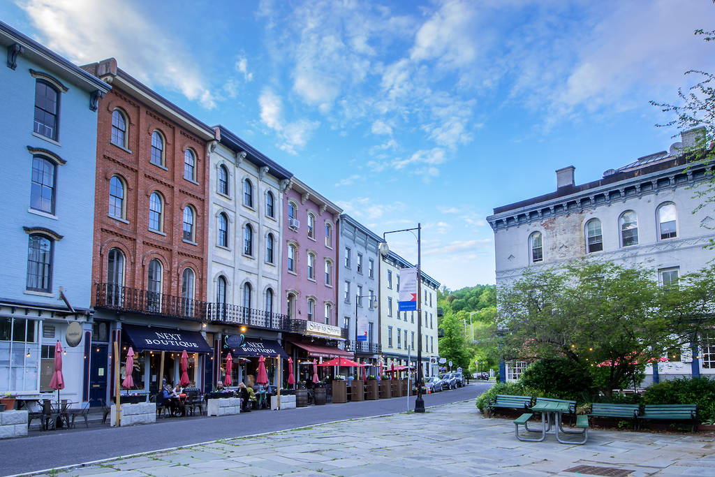 Kingston, NY - USA- May 12, 2021: a landscape view of the shops and restaurants on West Strand Street in The Rondout, Kingston’s historic waterfront