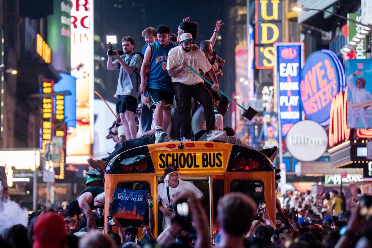 Five yellow school buses hired for World Cup transport destroyed in Knicks celebrations
