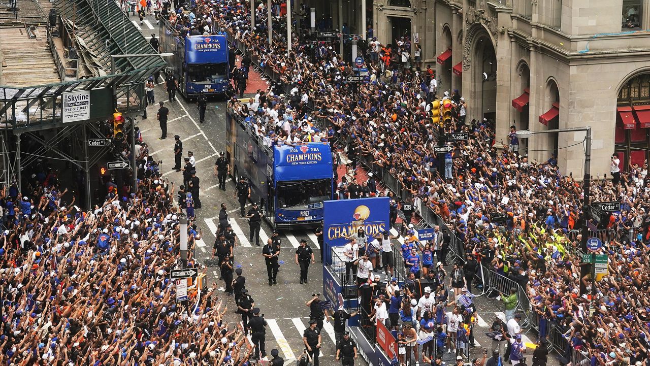 Crowds fill the sidewalks during the NBA Champion New York Knicks ticker-tape parade on Broadway, in New York's "Canyon of Heroes," Thursday, June 18, 2026. (AP Photo/Richard Drew)