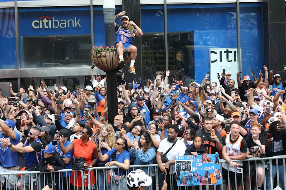 People attend a championship ticker-tape parade celebrating the New York Knicks' NBA Finals victory in New York on June 18, 2026.