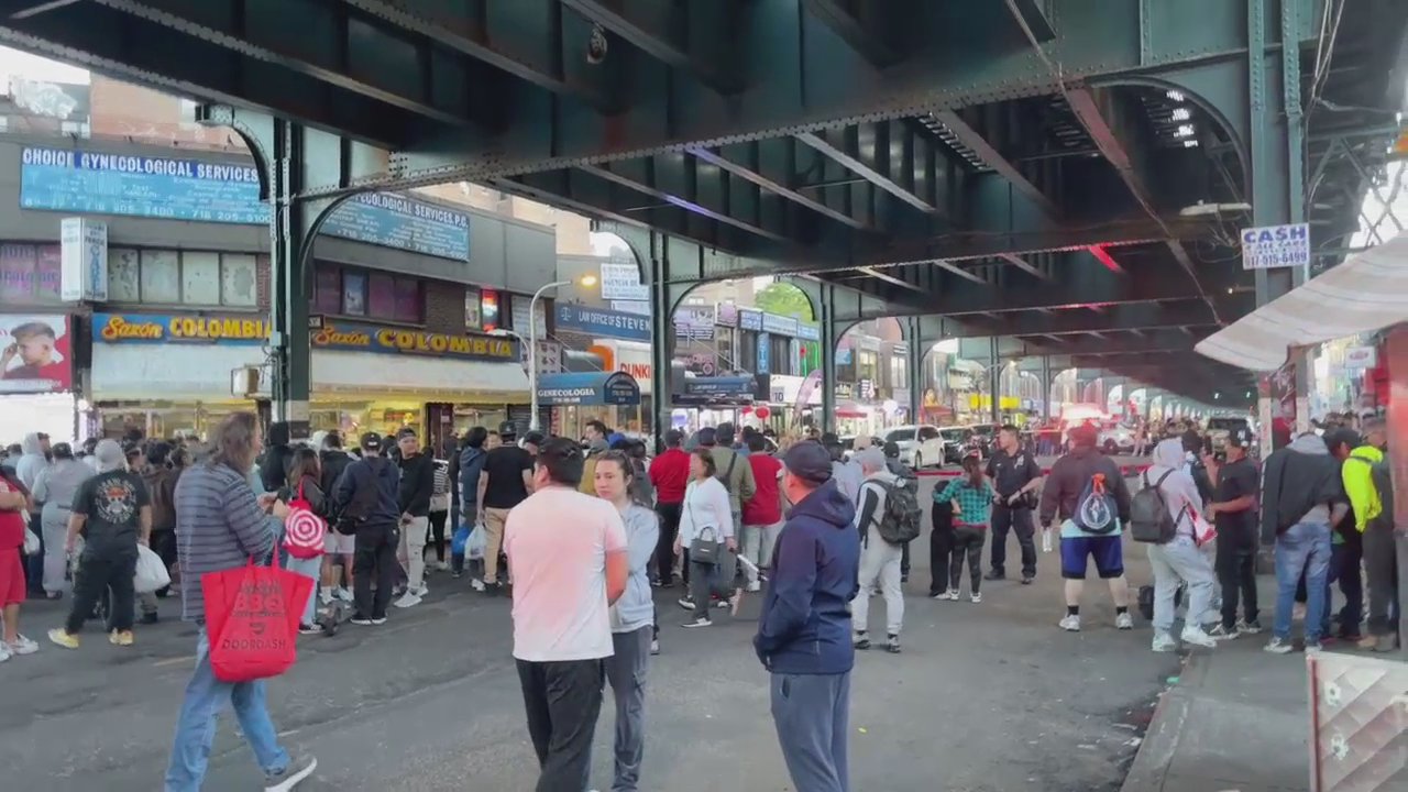 Crowds waited beneath the station for service to resume. 