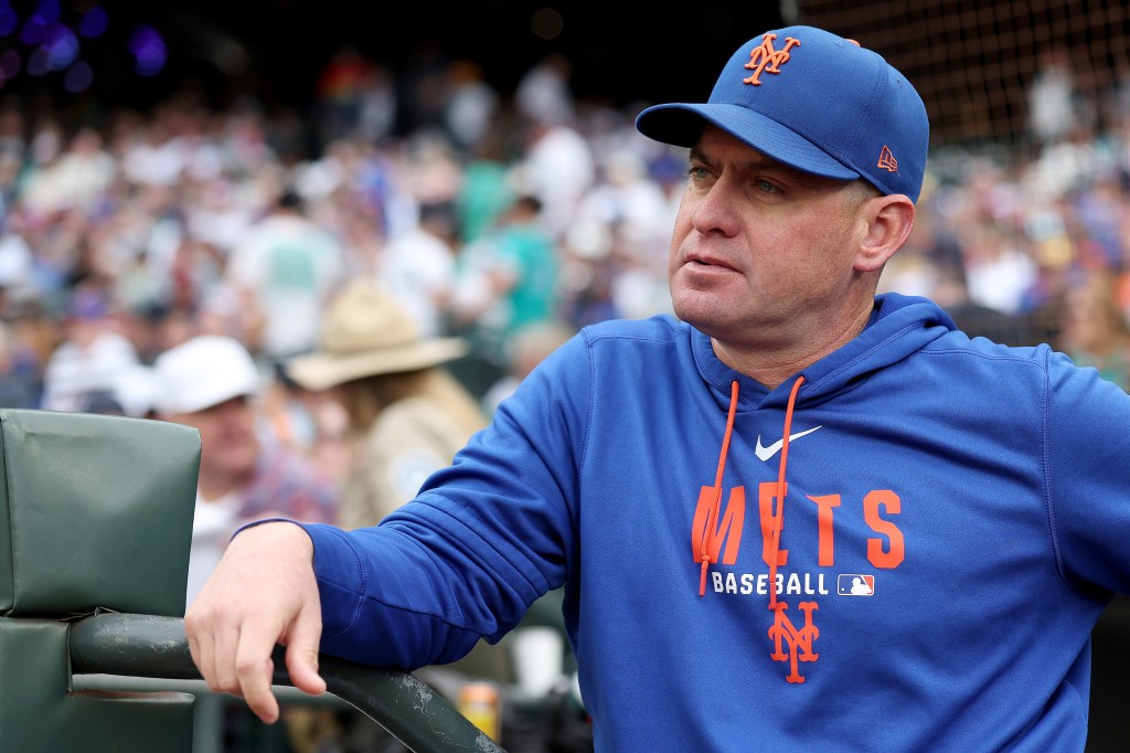 Manager Carlos Mendoza #64 of the New York Mets looks on before the game against the Seattle Mariners at T-Mobile Park on June 01, 2026 in Seattle, Washington.