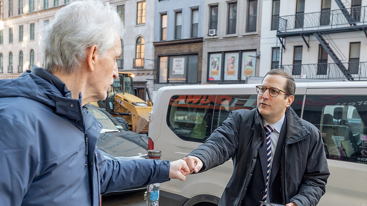 Democratic Party candidate Micha Lasher campaigns in New York City