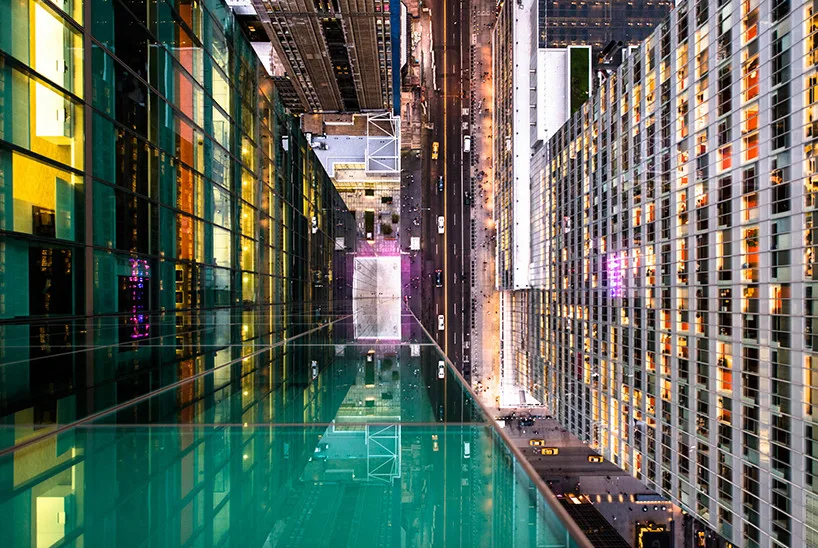 Broken reflections of Manhattan skyscrapers on glass surfaces.