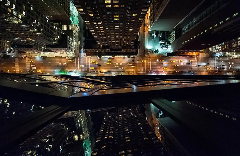 City buildings reflect in fragmented patterns on skyscraper glass.
