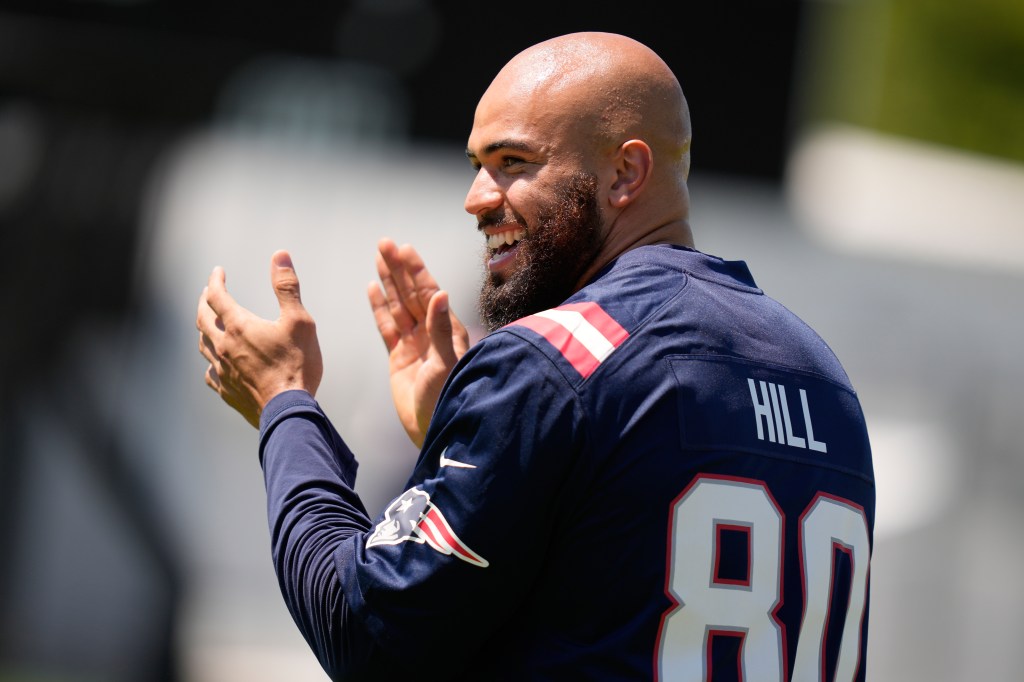 New England Patriots tight end Julian Hill applauds.