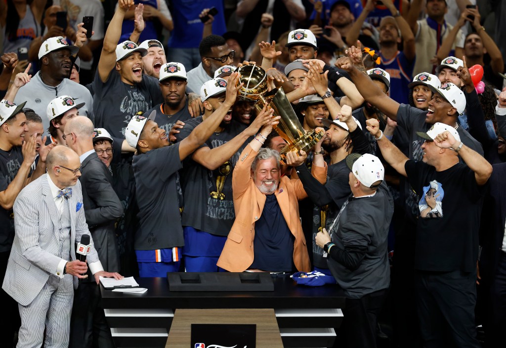 New York Knicks owner James Dolan celebrates with his team after becoming the 2026 NBA Finals Champions.