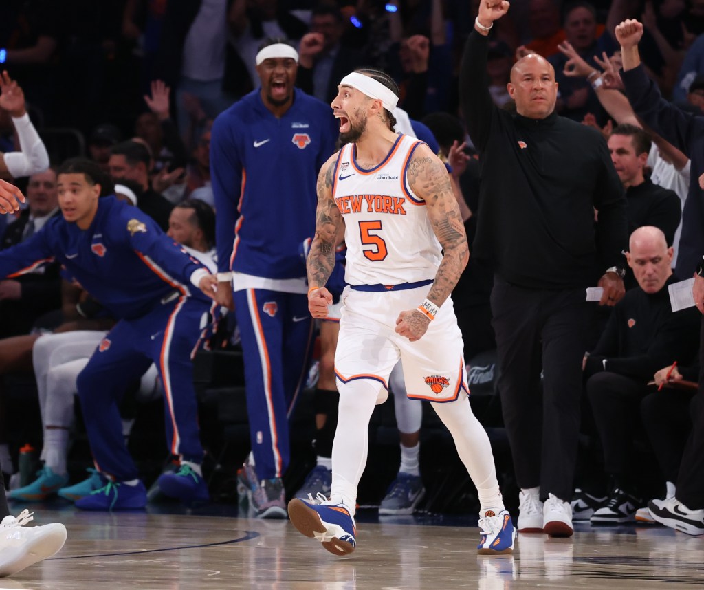 New York Knicks guard Jose Alvarado dribbling the ball against San Antonio Spurs guard Stephon Castle.