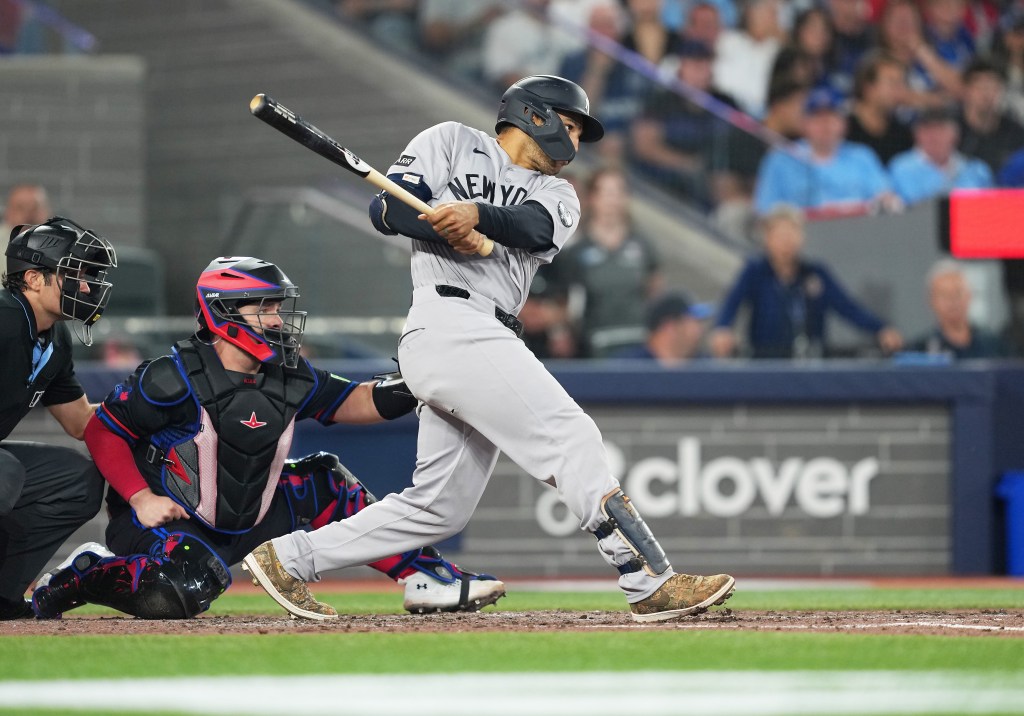 New York Yankees center fielder Trent Grisham hitting an RBI double.