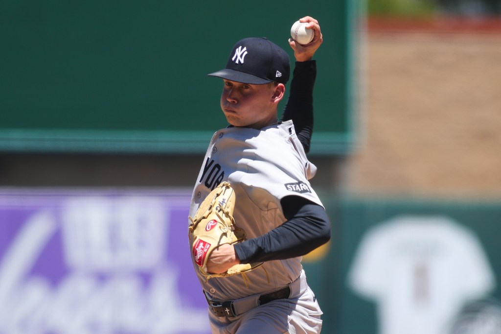 Will Warren, a New York Yankees pitcher, throws a baseball.