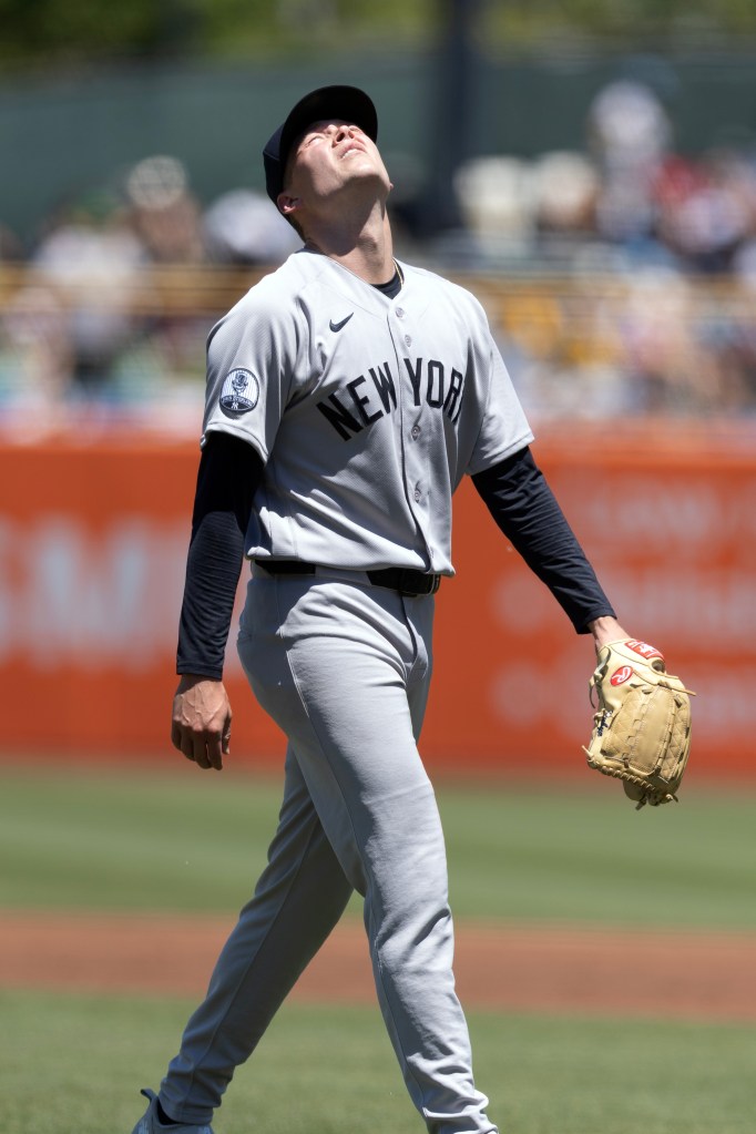 New York Yankees pitcher Will Warren looks up as he walks off the field.