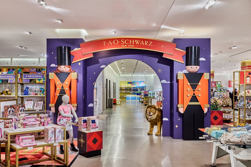 The entrance to FAO Schwarz at Nordstrom NYC Flagship with toy soldier figures and a plush lion.