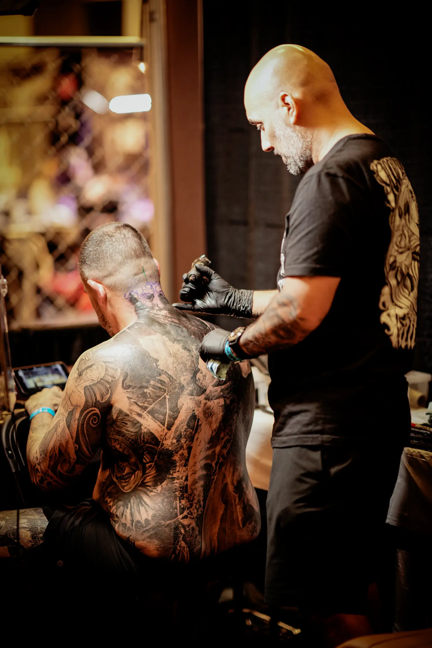 elaborate back tattoo by renowned carlos torres
