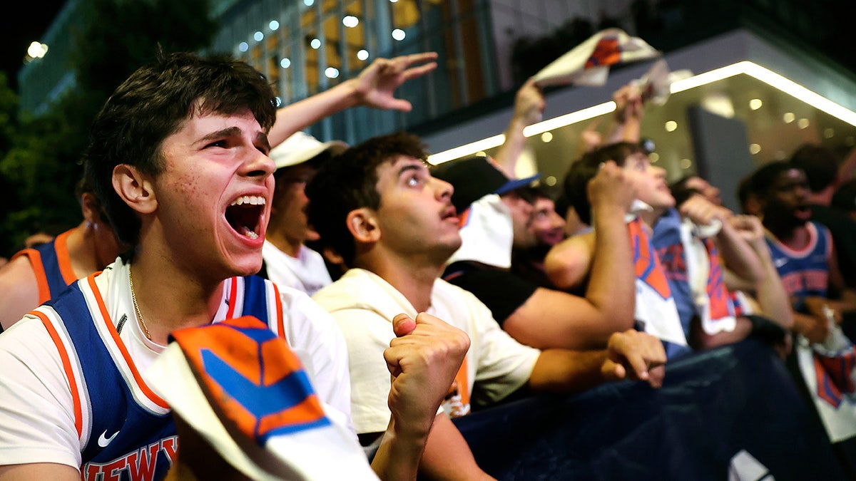New York Knicks fans watch Game 5 of the NBA Finals basketball series against the San Antonio Spurs, Saturday, June 13, 2026, in New York. (AP Photo/Heather Khalifa)