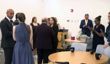 A photo of a group marking the expansion of the Abortion Access Hub.