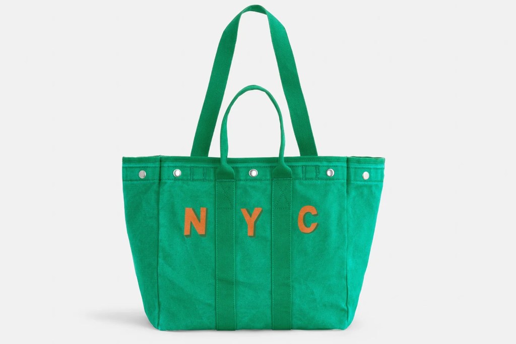 Green tote bag with "NYC" in orange letters.