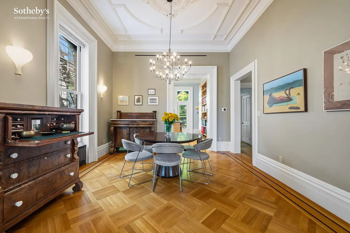 dining room with high ceiling, wood floor