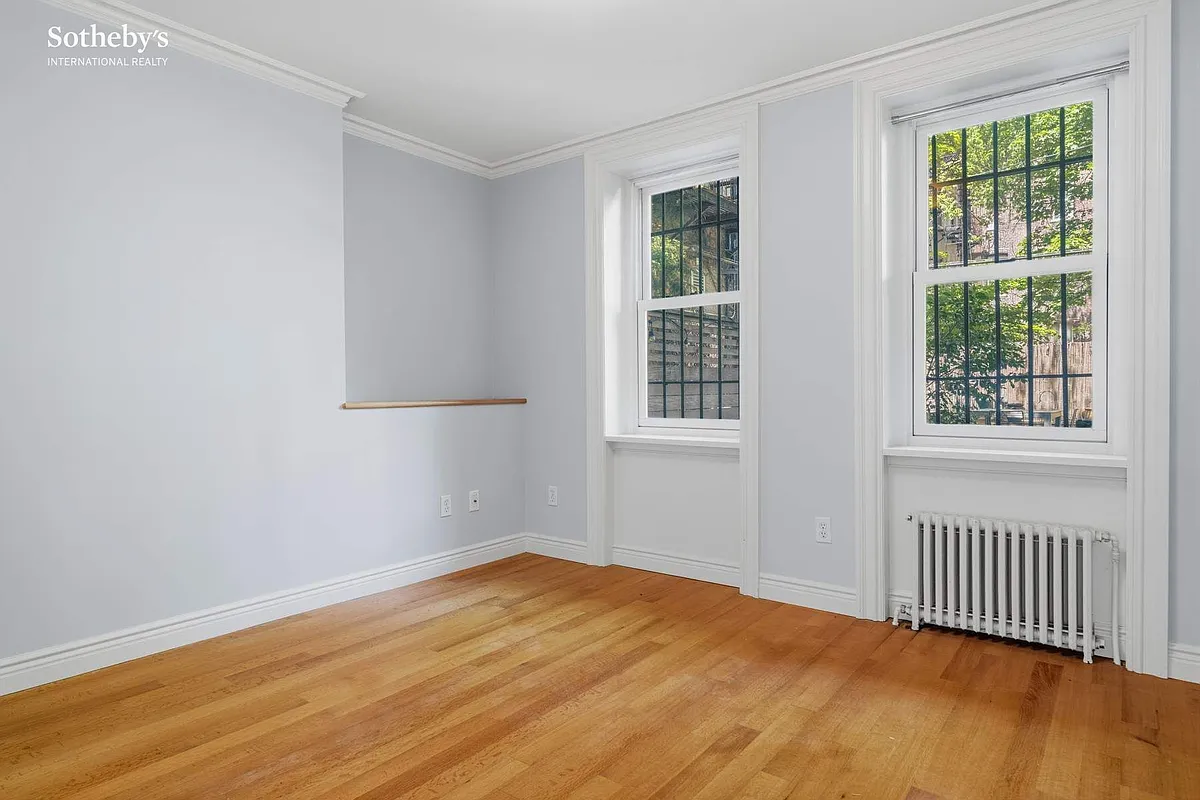 garden level bedroom with two windows
