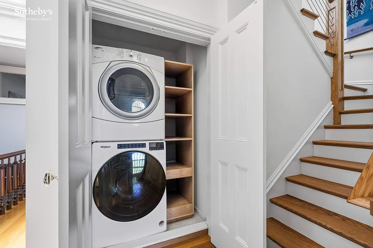 stacked washer and dryer in a closet