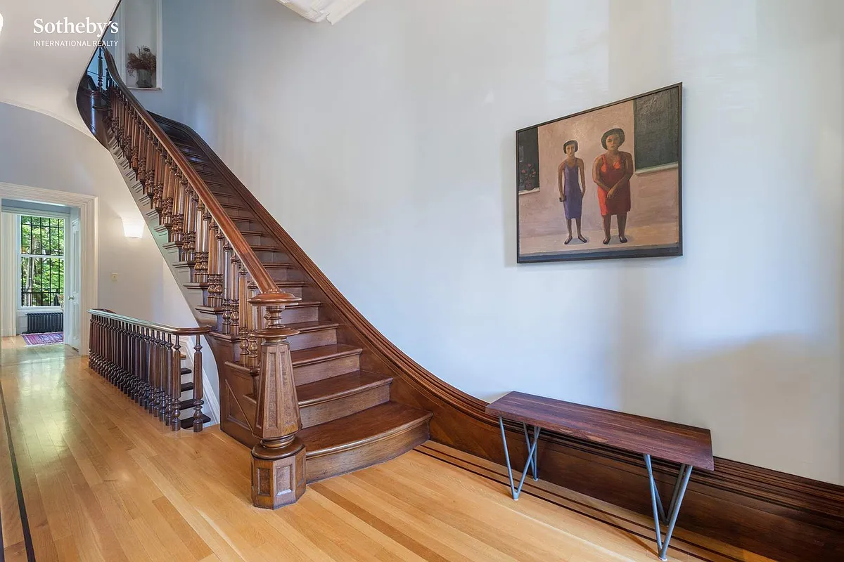 hall with stair with original newel post